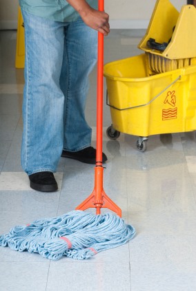Carpel Cleaning Corp janitor in Ridgewood, NJ mopping floor.
